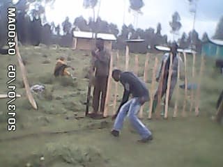 Community members building the fence around the health post